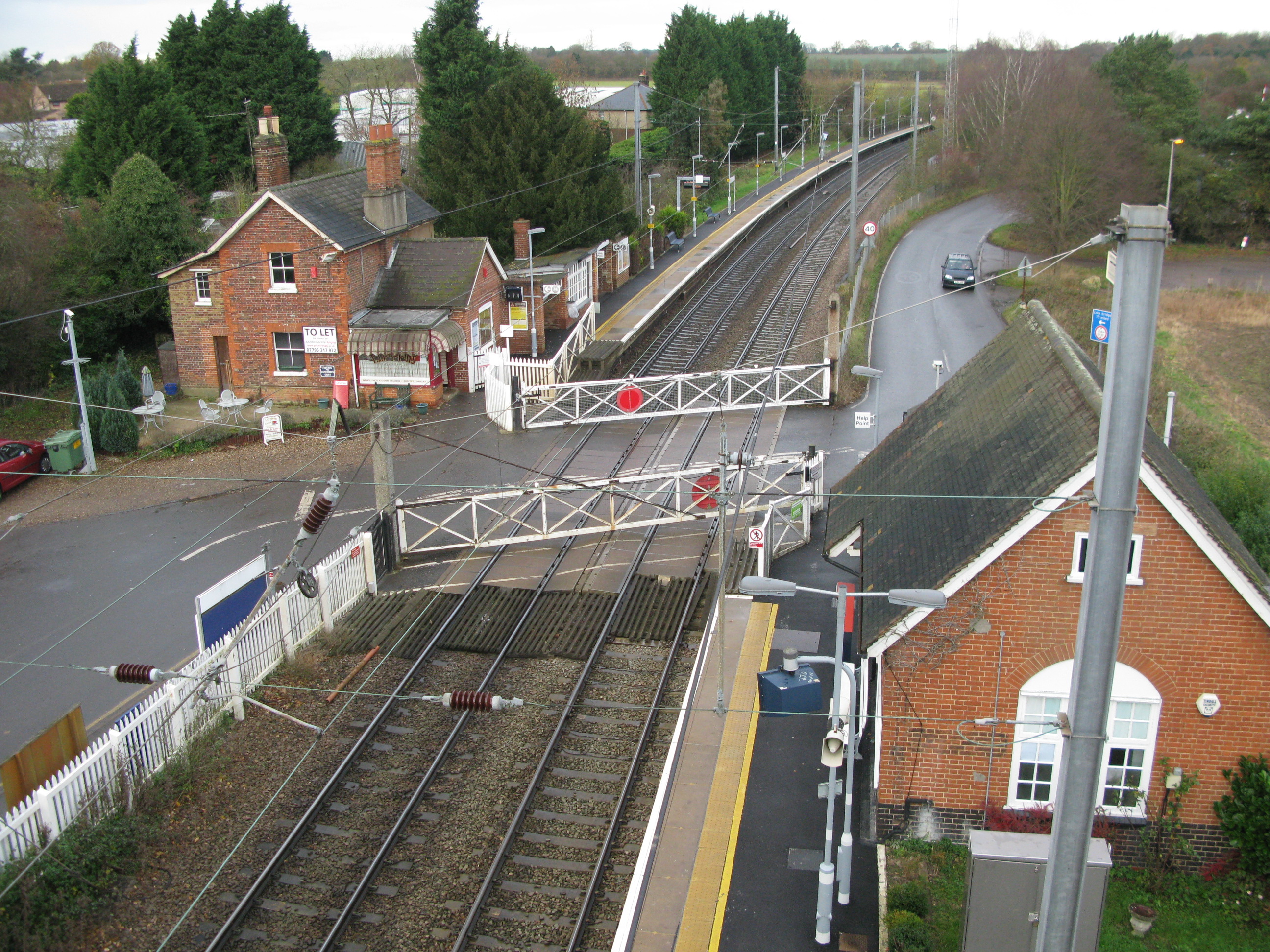 Elsenham station, view looking north from footbridge, shows crossing between staggered Up (lower right) and Down (upper left) platforms, and track curvature (Photo: © London Intelligence)