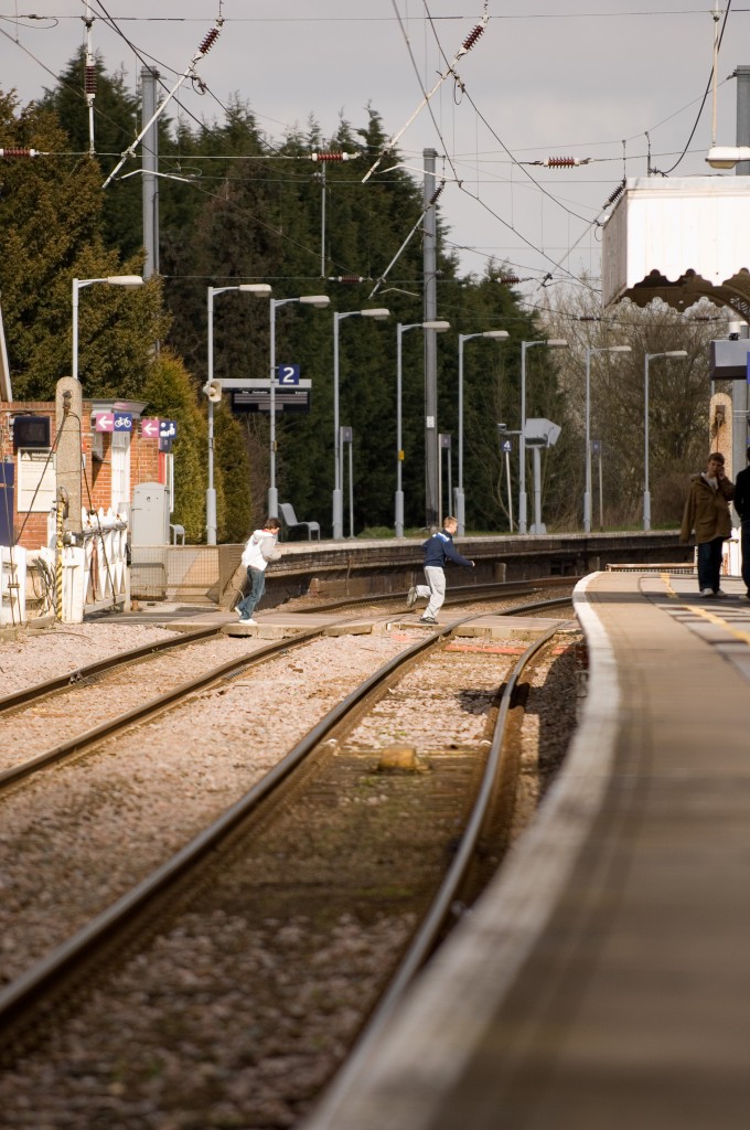 Photographer Simon Weir captures this image of two young people running across the Elsenham crossing in Spring 2006 (Photo: © Simon Weir simonweir.com)