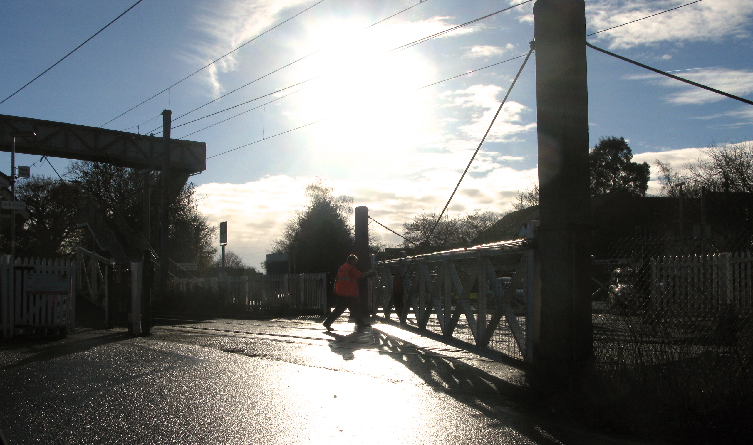 Elsenham level crossing keeper opens road gates December 2013 (Photo: © London Intelligence)