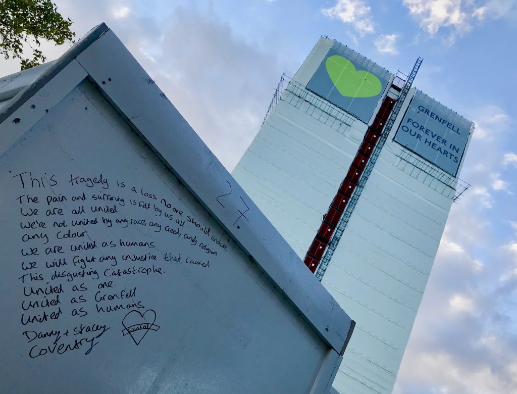 Grenfell Tower covered with 'Forever in Our Hearts' before being dismantled © London Intelligence ®.